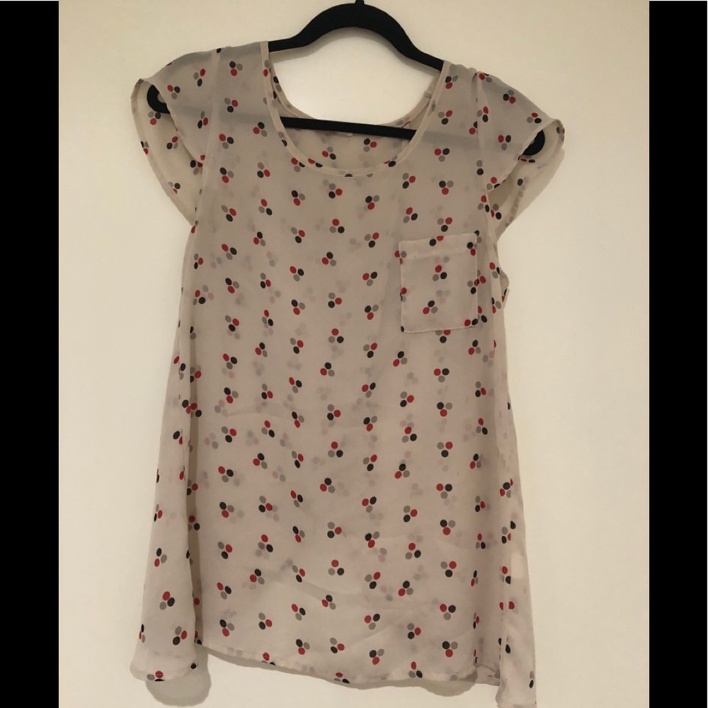 Polka dot top with fly away back overlap